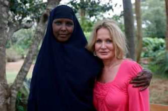 Donna (right) standing a Somali woman named Kathleen in Kenya near Nairobi. Kathleen had gotten severely ill after being cut and nearly died.